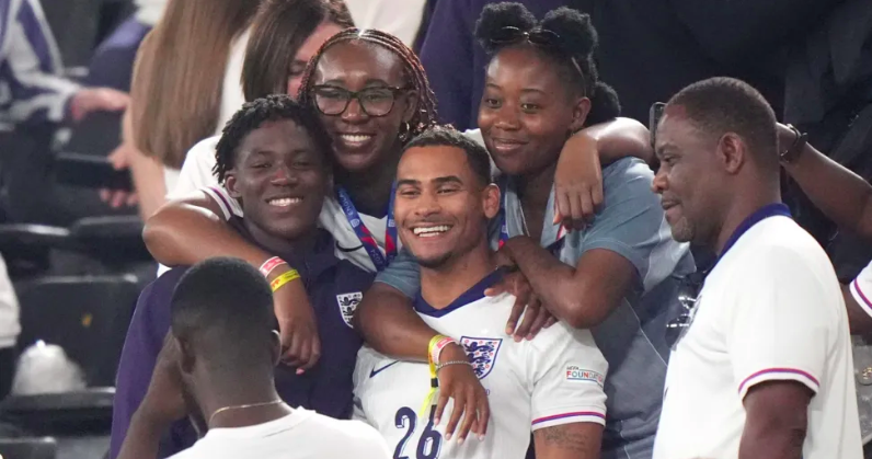 Kobbie Mainoo celebrates with his family after England's Euro 2024 semi-final win over the Netherlands