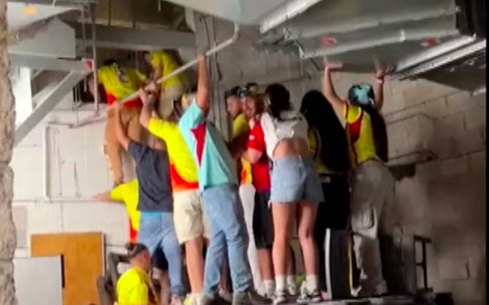 Fans climb into stadium air vents to get into a Copa America game